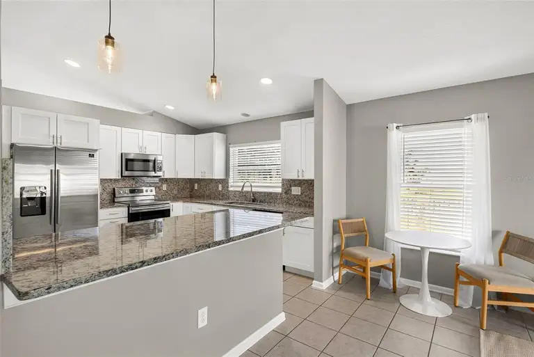 7619 CRESCENT PALM DR — photo 4