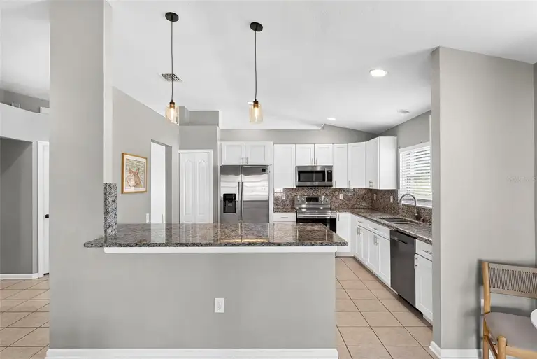 7619 CRESCENT PALM DR — photo 5