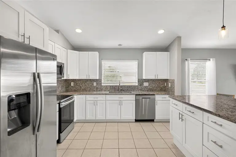7619 CRESCENT PALM DR — photo 3